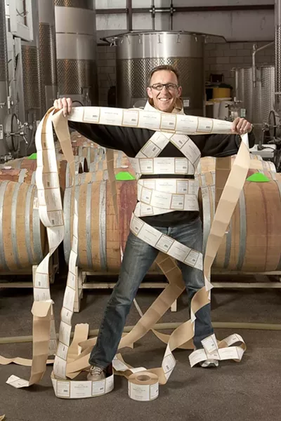 WRAPPED UP IN HIS WORK : Brian Talley is proud to put his vineyards’ name on the Bishop’s Peak label. He’s also excited to be working with the new team of assistant winemaker Eric Johnson and winemaking consultant Byron Kosuge. - PHOTO BY STEVE E. MILLER