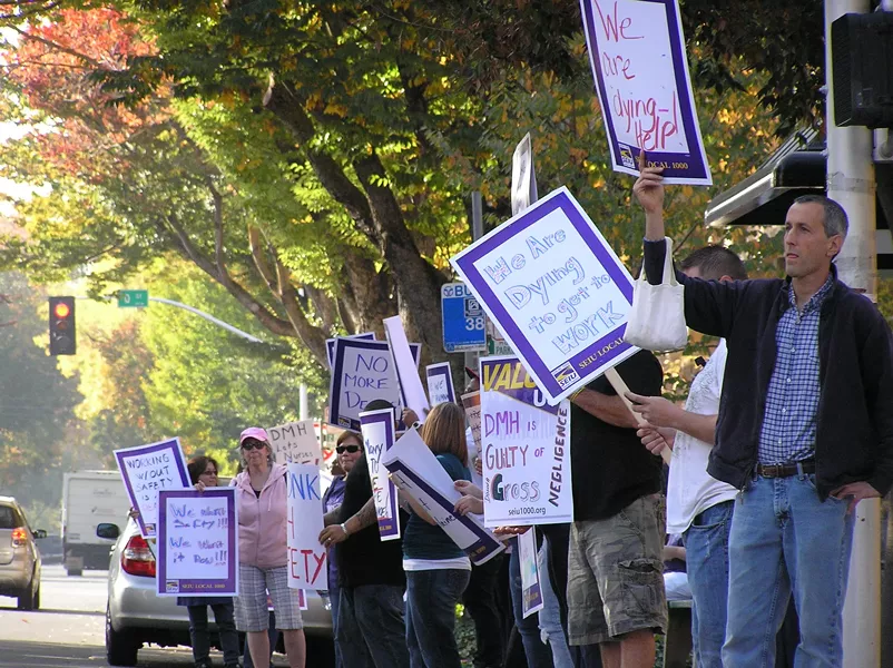 HAD ENOUGH : Dozens of employees from Napa State Hospital protested in front of the state Department of Mental Health headquarters after Donna Gross, 54 of Concord, was murdered, allegedly by a patient. - PHOTO BY COLIN RIGLEY