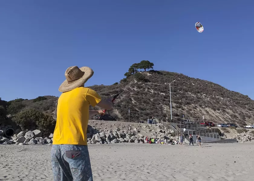 HIGH AS A ...: Aaron Lockwood, who was part of Maeva and Aileen’s wedding ceremony the day before Bill Murray’s birthday, mastered the art of kite flying with only a few near-fatalities. - PHOTO BY COLIN RIGLEY