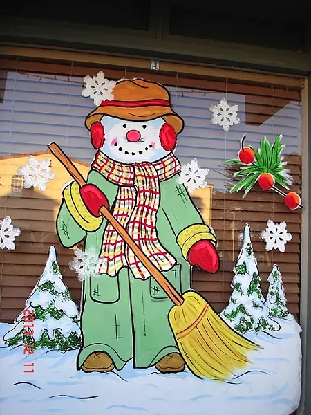 BUNDLED UP: You can see the variety in window painting styles with Marilyn Seim’s own snappily dressed snowman. - PHOTO COUIRTESY OF MARILYN SEIM