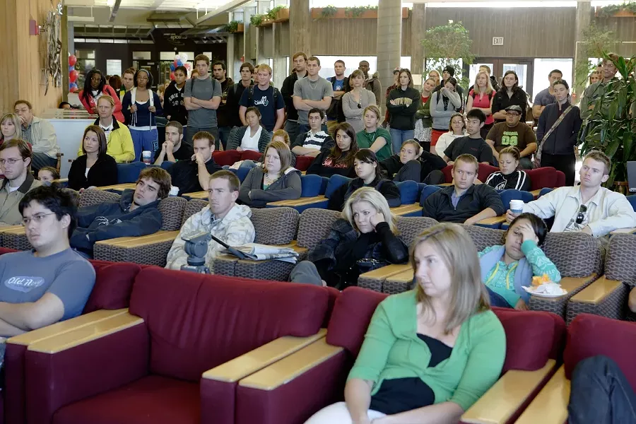 CAL POLY GETS A LESSON IN HISTORY : A packed Cal Poly University Union inauguration viewing. - PHOTO BY STEVE E. MILLER