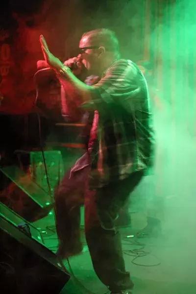 BEST HIP-HOP: Roach Clip of Famous Deuce & Roach Clip emerges from the fog during their rousing opening set. - PHOTO BY GLEN STARKEY