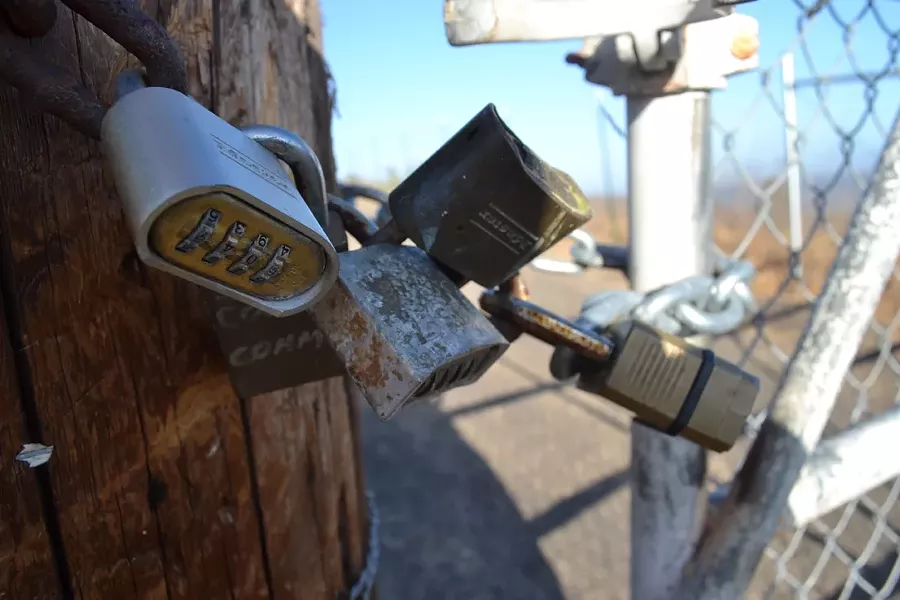 LAND LOCKDOWN: Defying multiple orders from the California Coastal Commission to remove unpermitted fences and signs, Ontario Ridge landowner Rob McCarthy has continued to construct and maintain barriers to keep hikers off of a popular trail. - PHOTO BY RHYS HEYDEN