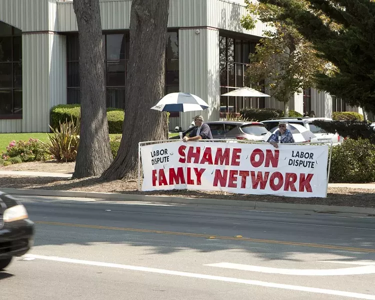 BANNER YEAR: Members of the Carpenters Local 1800, an Arroyo Grande-based union, have been bannering Family Care Network, Inc., a local family services nonprofit, because subcontractors working on the nonprofit’s new building allegedly don’t meet “area labor standards for all their carpenter craft workers.” - PHOTO BY STEVE E. MILLER