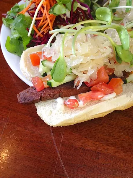 THE SMILING DOG: Bliss Café in downtown SLO offers up vegan hot dogs that feel decadent, but actually rack up good karma points instead. - PHOTO BY HAYLEY THOMAS