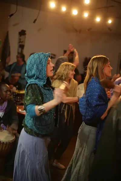 BLISS OUT!: The energy in the room is palpable as attendees dance for rain. - PHOTO BY GLEN STARKEY