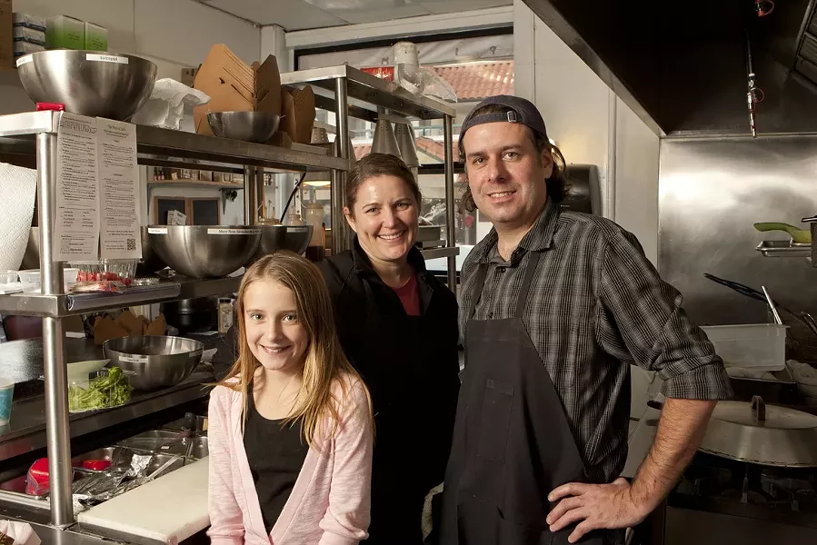 FAMILY OF CHIPS : There are 10 different flavors of freshly made potato chips on the menu at Chipwrecked, all made by the family team of (left to right) Larkin, Sarah, and Dan Paddack. - PHOTOS BY STEVE E. MILLER