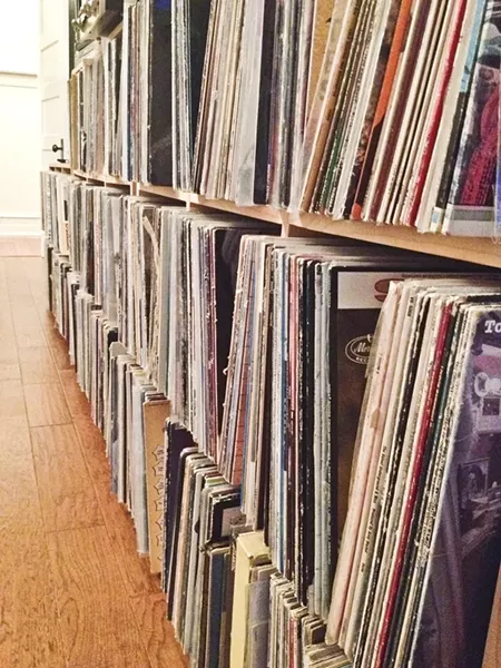 PINE AND DANDY: Unfinished pine bookcases provide a clean looking, sturdy storage space for my vinyl treasures. - PHOTO BY ERIN MESSER