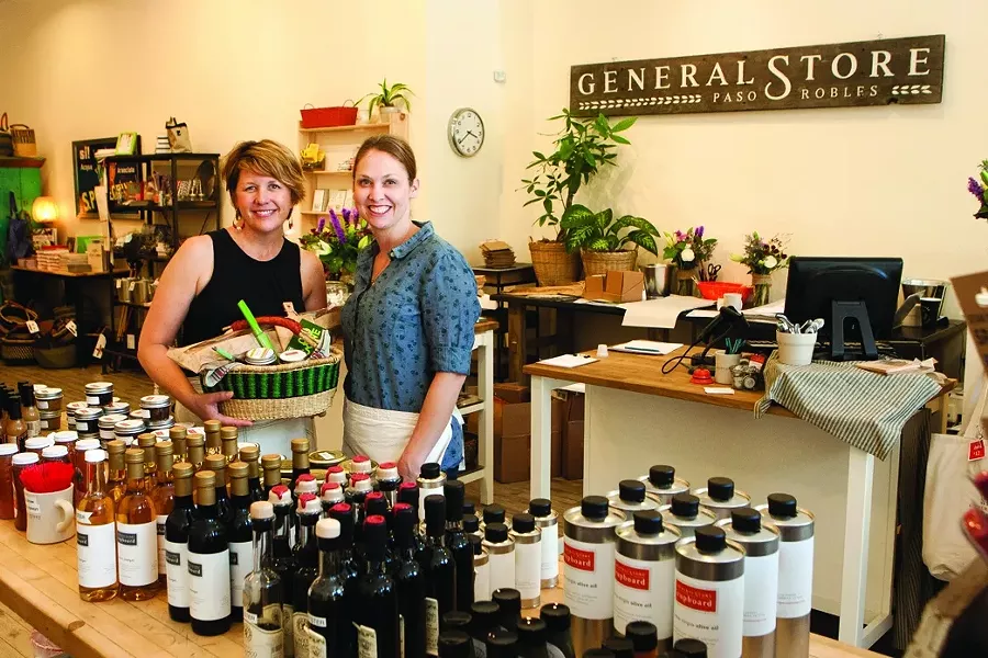 GENERALLY COOL : Downtown Paso Robles now has a store full of goodies for awesome picnic baskets (like the one Joeli Yaguda is holding on the left next to Jillian Waters) or for general household usage. - PHOTO BY STEVE E. MILLER