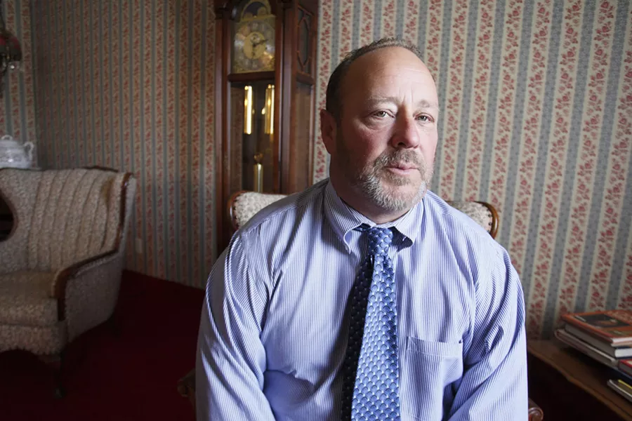 FALL GUY : Kirk Reis, operator of Reis Family Mortuary, absorbs the costs when families of the dead and the county can’t or won’t pay for the burial. - PHOTO BY STEVE E. MILLER