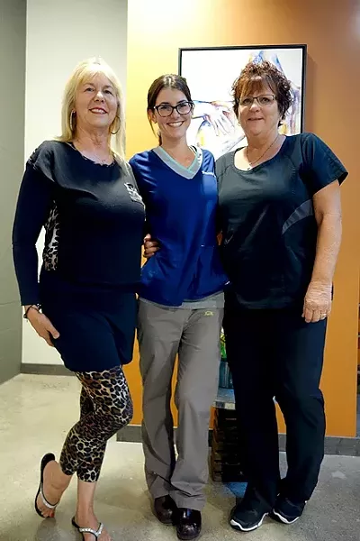THE LADIES OF OPEN CANVAS : (Left to right) Mom Kathy Cohen, Open Canvas Laser co-owner and daughter Emerald McLeod, and employee Maggie St. Vincent greeted wandering art lovers last Friday. - PHOTO BY GLEN STARKEY