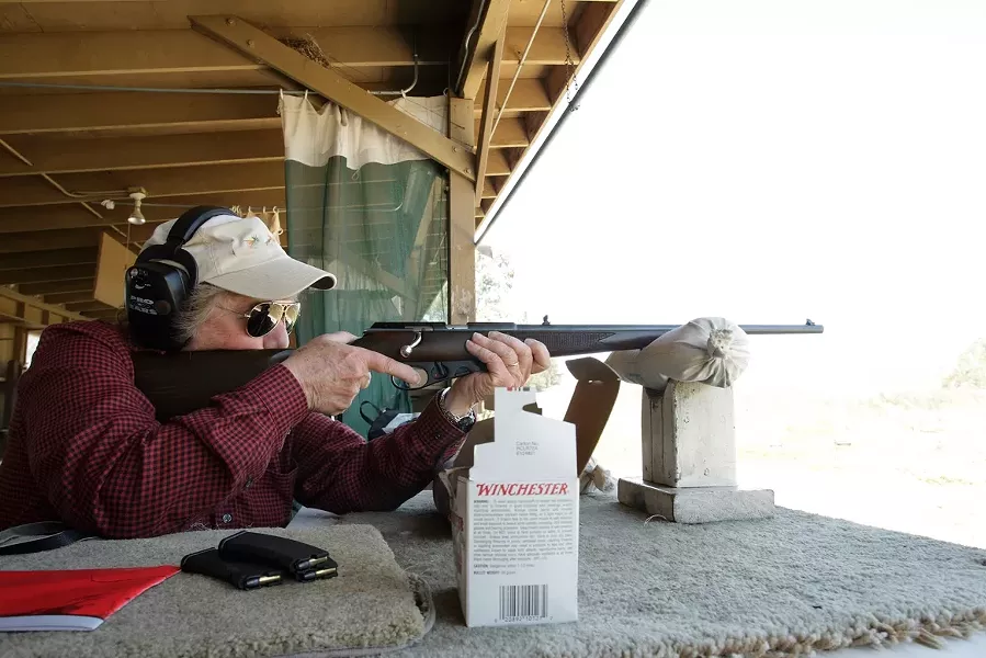 THE BADASS : Though nearing 70, former U.S. Marine Corp Captain Jo Ann Wheatley is still deadly accurate and passes on her expertise onto other women in Pistol Safety & Handing classes. The former Cal Poly professor is also an NRA Certified Instructor. - PHOTO BY STEVE E. MILLER