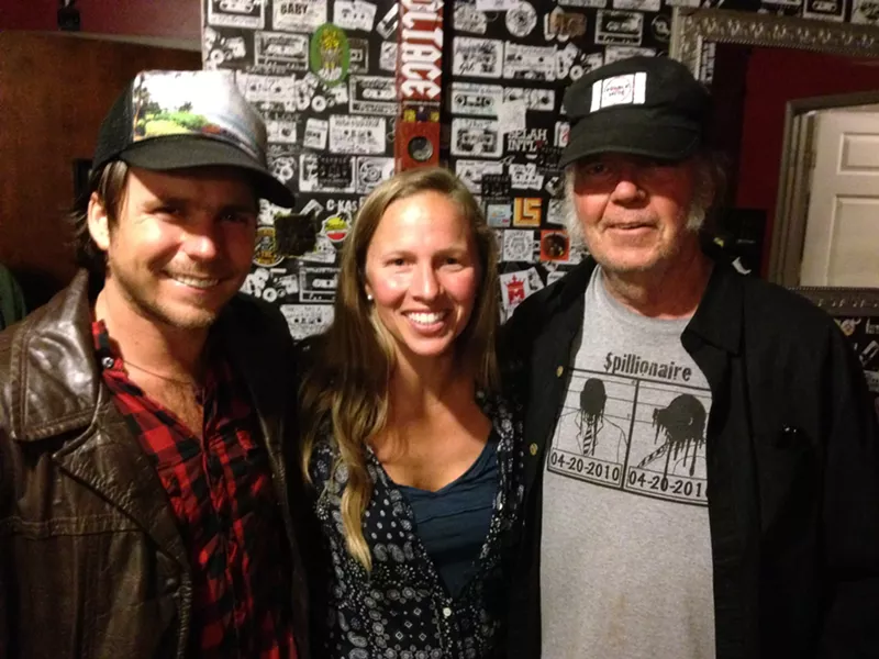 THANK YOU, GOOD MEDICINE PRESENTS!: Willie Nelson’s son Lukas Nelson (left), Good Medicine Presents co-owner Korie Newman (center), and iconic rocker Neil Young (right) joined forces to play a last minute, secret concert at SLO Brew. - PHOTO BY GLEN STARKEY