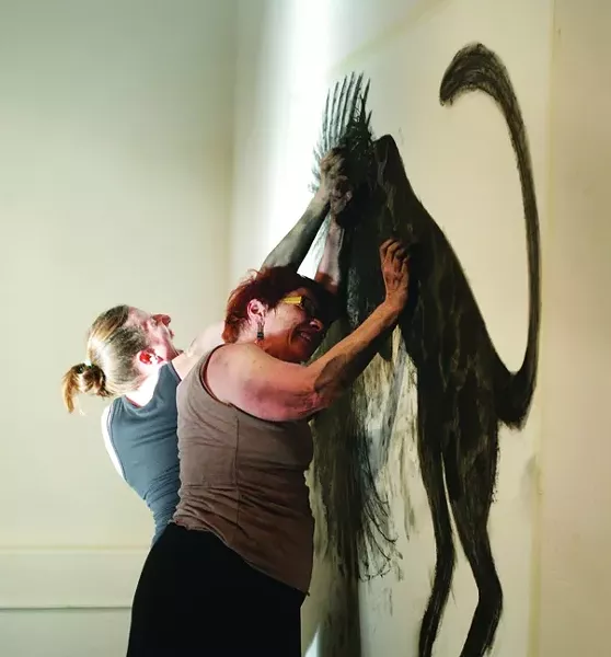 GRRL FIGHT!: Adrienne Allebe and Peg Grady battle it out to try to finish their charcoal drawing. - PHOTO BY GLEN STARKEY