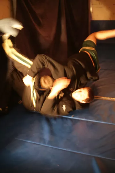 TAKEDOWN! : Cal Poly wrestlers provided sports action with wrestling demos throughout the evening. - PHOTO BY GLEN STARKEY