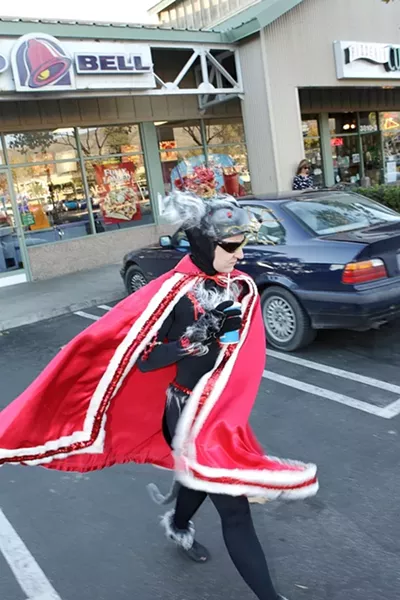 HEALTH CODE VIOLATION?: Our New Times photographer tracked the Rat King to the Taco Bell at the Marigold Center where he was met with hostility. - PHOTO BY STEVE E. MILLER