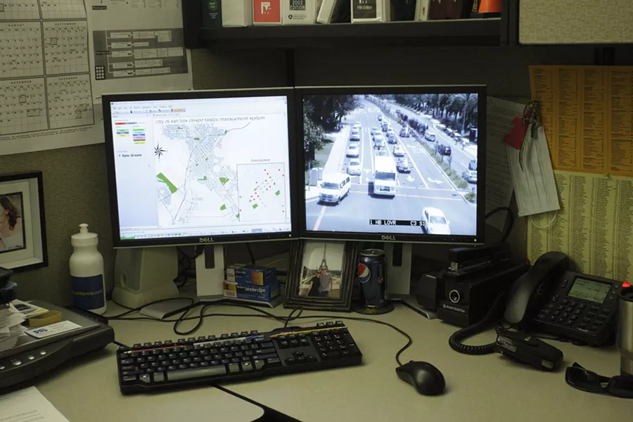 TOTAL CONTROL : From his cubicle in the SLO Public Works Department, Senior Traffic Engineer Jake Hudson can at any time access video feeds from traffic cameras throughout the city. - PHOTOS BY STEVE E. MILLER