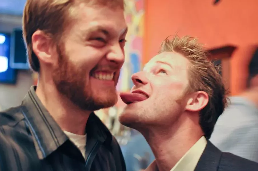 NO FACE LICKING, PLEASE : Next generation reporters Matt Fountain and I perform the official New Times initiation ritual. - PHOTO BY ANNA WELTNER