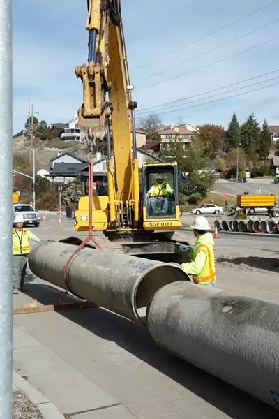 NO WAY OUT: Water from a broken water pipe trapped Jake Gaines and Manuel Villagomez in a 30-inch-diameter pipe, buried 10 feet in a trench. - PHOTO BY STEVE E. MILLER