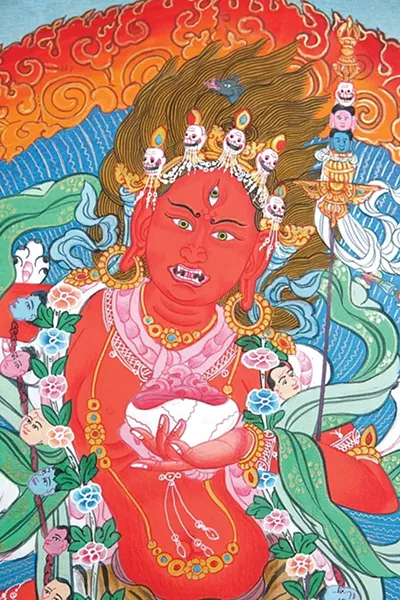 WRATHFUL GODDESS : A depiction of Vajra Yogini, the feminine manifestation of divine wisdom, described as having the upper face of a pig and three eyes. In the bend of her left elbow rests a katvanga staff and she wears a crown of five dry human skulls and a necklace of 50 - PHOTO BY STEVE E. MILLER