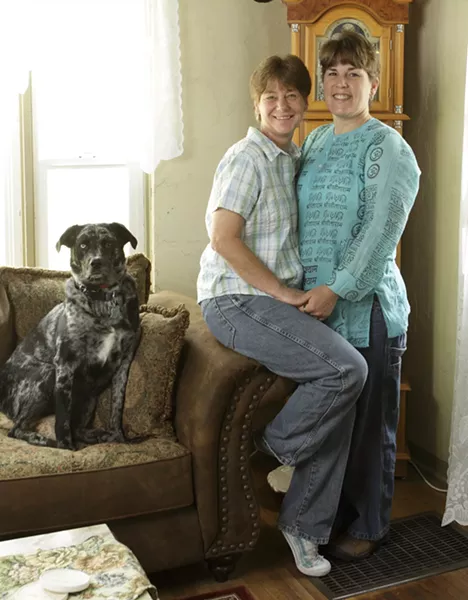 KELLY AND VICKI : Vicki Dunning (left) and her wife Kelly Baptista have been together eight years. They had a commitment ceremony in 2001, became legal domestic partners one year later, and legally married six years later. Now they have to wait and see if the marriage survives in court. - PHOTO BY STEVE E. MILLER