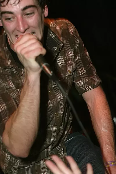 SING IT LIKE YOU MEAN IT! : PK’S Travis Hawley rips into one of his band’s new songs during their album release party at Downtown Brew - PHOTO BY GLEN STARKEY
