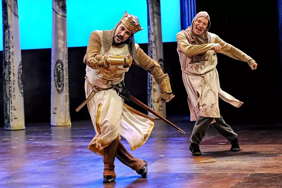 ALWAYS LOOK ON THE BRIGHT SIDE OF LIFE : King Arthur (Joseph Cannon, left) and his squire Patsy (Billy Breed) do a little cheering-up song in PCPA’s production of Monty Python’s Spamalot, directed by Michael Barnard. - PHOTO BY LUIS ESCOBAR/REFLECTIONS PHOTOGRAPHY STUDIO