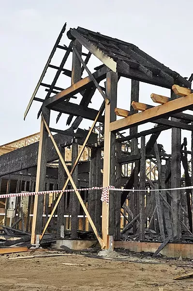 REMAINS: An Nipomo house fire on April 5 destroyed an unfinished structure intended for farmworker housing under H-2A, a government program for temporary foreign farmworkers. - PHOTO BY CAMILLIA LANHAM
