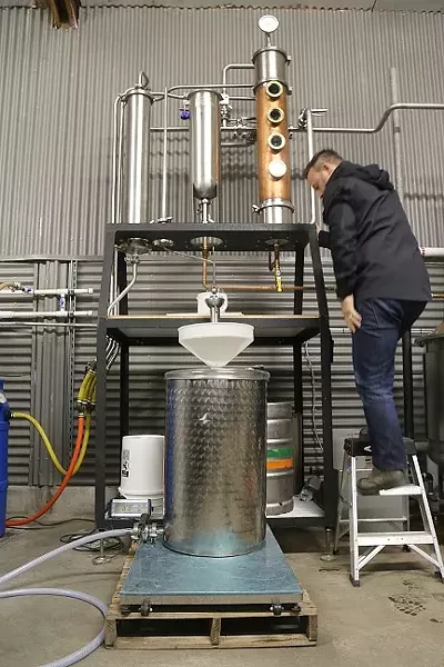 ALL IN A DAY’S WORK: With a combined 40 years of winemaking experience, Stephen Kroener (pictured) and distillery co-owner Joe Barton know a thing or two about manipulating wine grapes into high-proof spirits. - PHOTO BY DYLAN HONEA-BAUMANN