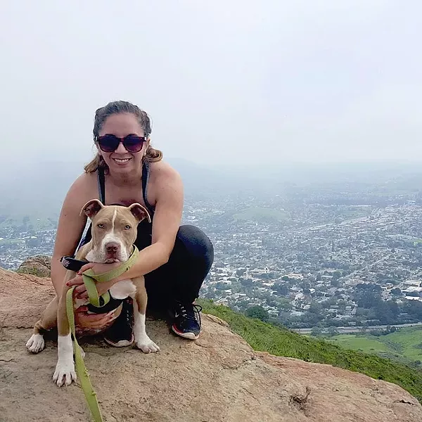 STARTED FROM THE BOTTOM, NOW WE’RE HERE: After being put in puppy leg casts to heal his front legs that were bent due to malnourishment, Hercules the puppy is now hiking Madonna Mountain like a champ. - PHOTO COURTESY OF RYAH COOLEY