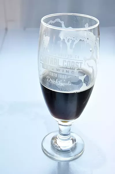BLACK ATTACK : Central Coast Brewing’s Catch 23 is a black rye IPA with plenty of roasted malt and a hoppy kick. - PHOTO BY CAMILLIA LANHAM
