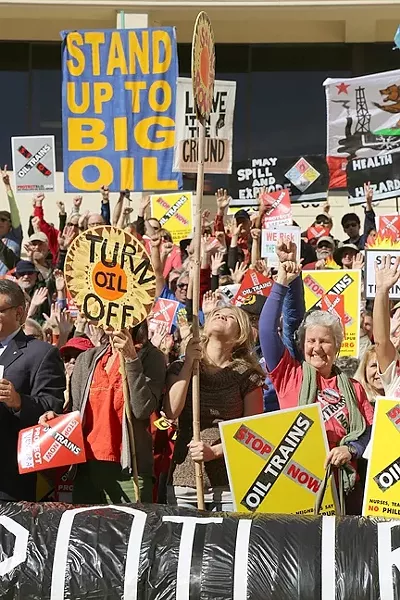 ENTRENCHED OPPOSITION: Protesters rally against oil trains at a SLO County Planning Commission hearing on the Phillips 66 rail spur project earlier this year, and they still haven’t changed their minds. - FILE PHOTO BY DYLAN HONEA-BAUMANN