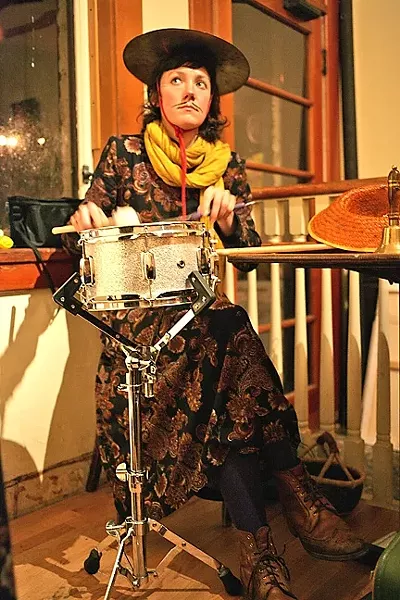 GONG : Percussionist Rakka Down keeps the rhythm and punctuates the proceedings by tapping her cymbal hat. - PHOTO BY GLEN STARKEY