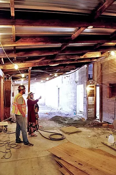 GOOD BONES: Town Manager Aarika Wells and specialty construction site manager Dustin Bauer discuss plans for the old creamery’s renovations. - PHOTO BY DYLAN HONEA-BAUMANN