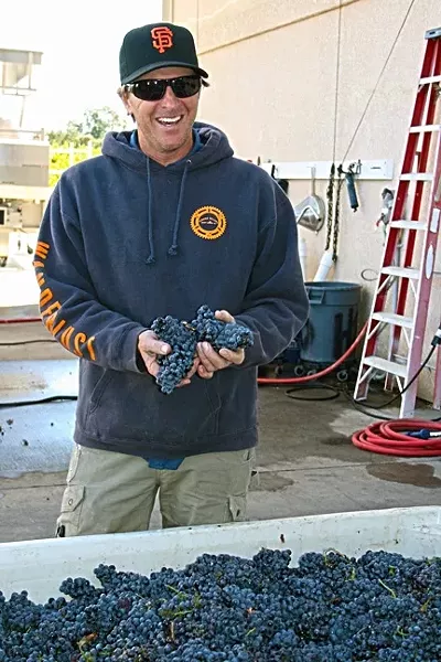FRUITFUL : Zenaida Cellars owner/winemaker Eric Ogorsolka is rich with mourvedre grapes this harvest. - PHOTO BY HAYLEY THOMAS CAIN