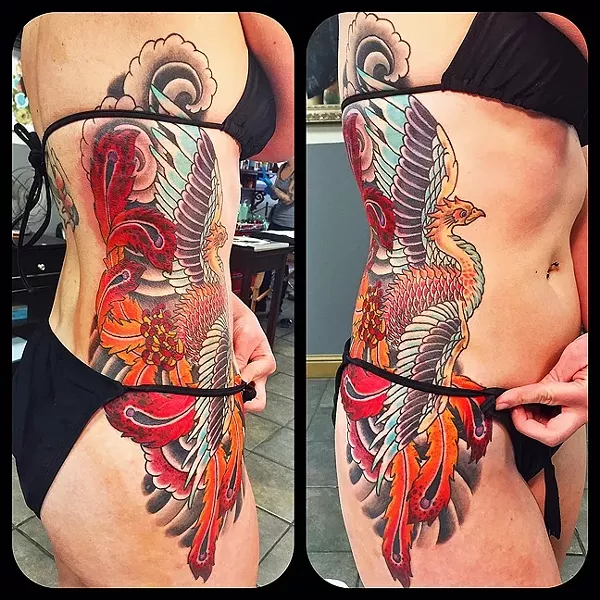 SUN’S OUT, TATTOOS OUT: This colorful bird tattoo by Gary Ellsworth on a client’s side can easily be covered up for work and at the pool. - PHOTO COURTESY OF GARY ELLSWORTH