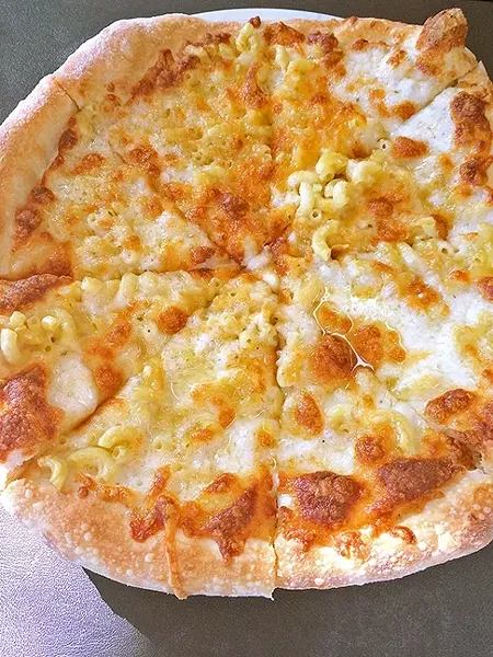 ROOSTER CREEK TAVERN: While Rooster Creek Tavern’s mac ’n’ cheese pizza is a creative twist on a traditional dish, it fell short with the heavy use of truffle oil. - PHOTO BY RYAH COOLEY