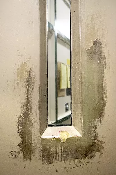 INSIDE LOOKING OUT: Inmates struggling with mental illness could see their conditions worsen as they wait for court-ordered transfers to local or state mental health facilities. - PHOTO BY JAYSON MELLOM