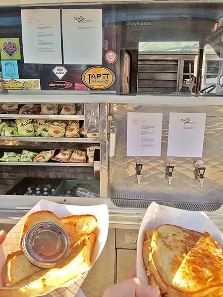 THE INCIDENT: Puppy Love night at Bang the Drum Brewery wouldn’t have been complete without the service of the Grilled Cheese Incident food truck. - PHOTO BY PETER JOHNSON