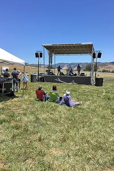 OPEN SPACE: The only un-crowded area was in front of the stage, where Spoon Canoe delivered some great but largely ignored tunes. - PHOTO BY GLEN STARKEY