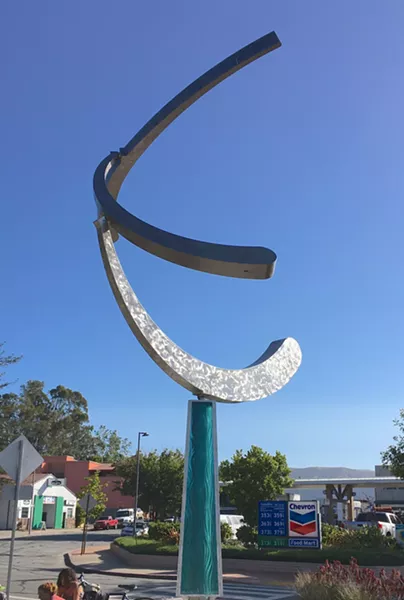 WELCOME Olas Portola, (pictured left) whose lower glass shroud suggests water and three kinetic arms mimic waves, graces the southern entrance to downtown SLO. - PHOTO BY GLEN STARKEY