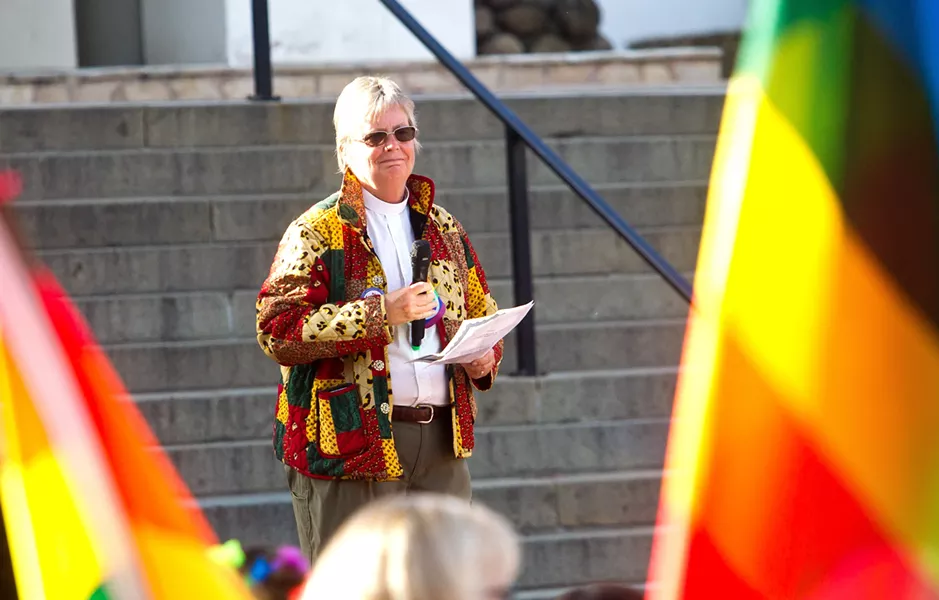 COLLABORATE The Rev. Caroline Hall speaks at the June 7 LGBT rally in Mission Plaza. Hall is one of several local pastors working to create a welcoming community of faith in SLO County. - PHOTO BY JAYSON MELLOM