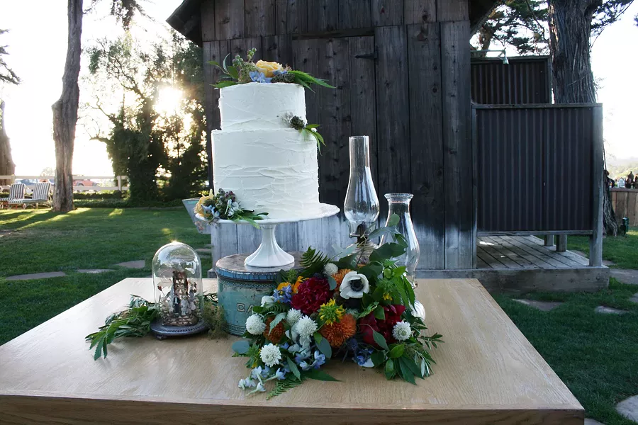 ELEGANT MUNCHIES This wedding cake looks normal enough, but on closer inspection you'll find marijuana leaves crawling up the side. - PHOTO BY HAYLEY THOMAS CAIN