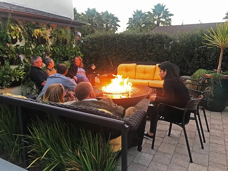 SNAP, CRACKLE With patio dining out back and a cozy outdoor fireplace in front, Blue Heron offers expansive views of the bay in a chic setting.