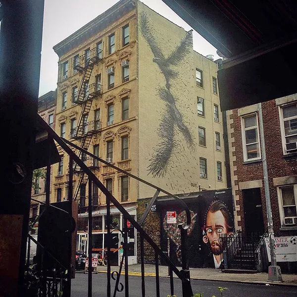 URBAN ART I snapped a photo of this street wall art while drinking refreshing lemonade at a Greenwich Village cafe. - PHOTO BY PETER JOHNSON