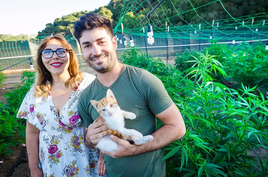 SMALL BIZ UNDER FIRE Megan's Organic Market co-founders Megan Souza and Eric Powers face an uncertain future as SLO County sues to stop the delivery service's cannabis grow in Los Osos. - PHOTO BY JAYSON MELLOM