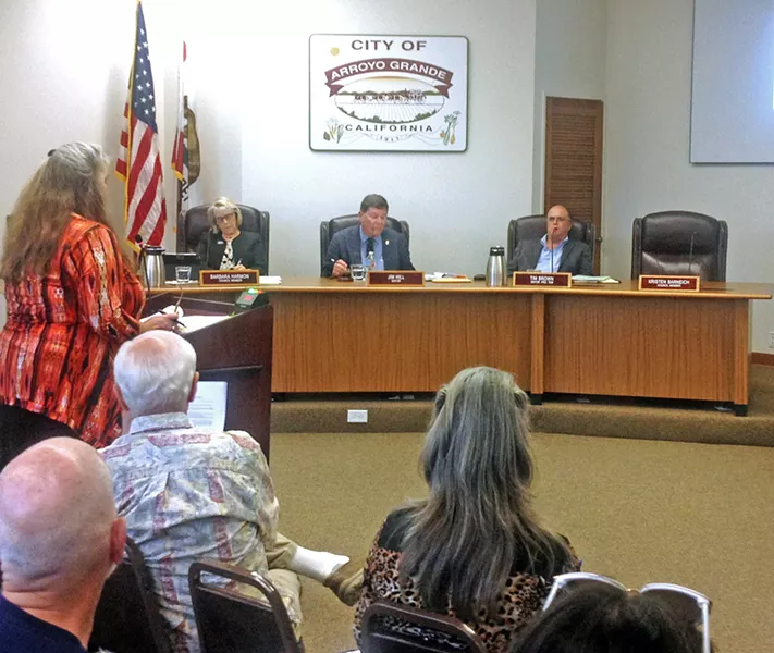 MIXED MESSAGES The results of an investigation into Arroyo Grande Mayor Jim Hill (center) found evidence that supported some allegations of misconduct, while debunking others. The report's release drew Hill's supporters like Julie Tacker (pictured standing left) to a recent City Council meeting. - PHOTO BY CHRIS MCGUINNESS