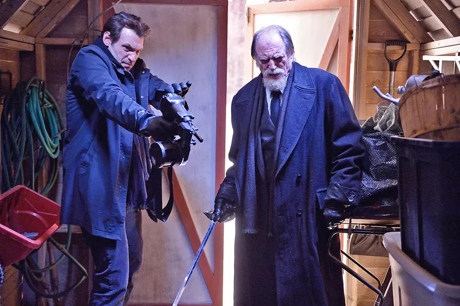 TAKE THAT, BLOODSUCKER! Armed with a silver-spike-shooting nail gun, CDC Dr. Ephraim "Eph" Goodweather (Corey Stoll, left) and sword-wielding vampire hunter Professor Abraham Setrakian (David Bradley) set about trying to end an outbreak of vampirism in NYC. - PHOTO COURTESY OF FX