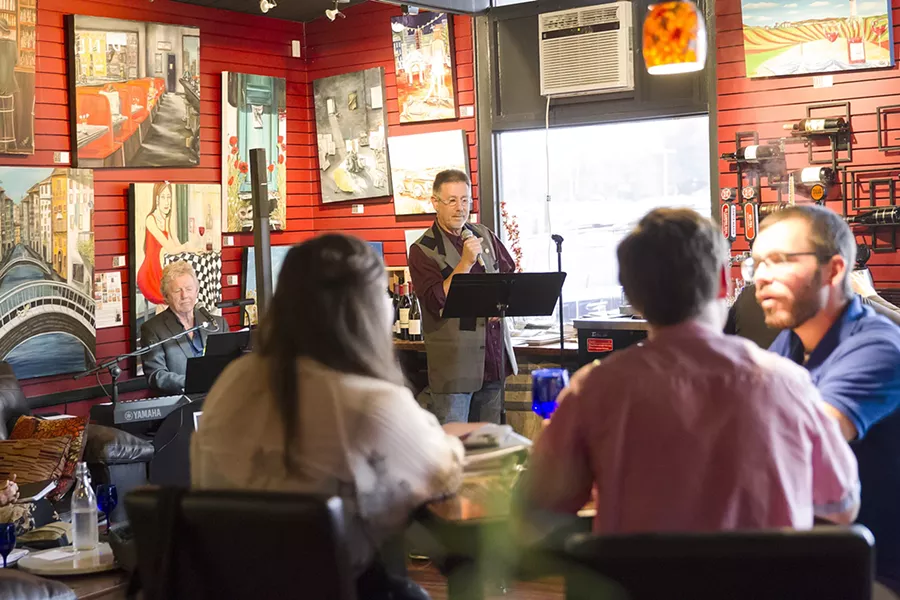 THE JOY OF SONG Grant Crowl, the teacher behind Cuesta College's cabaret class and the group Cabaret 805, sings a tune at Stax Wine Bar in Morro Bay. - PHOTO BY JAYSON MELLOM