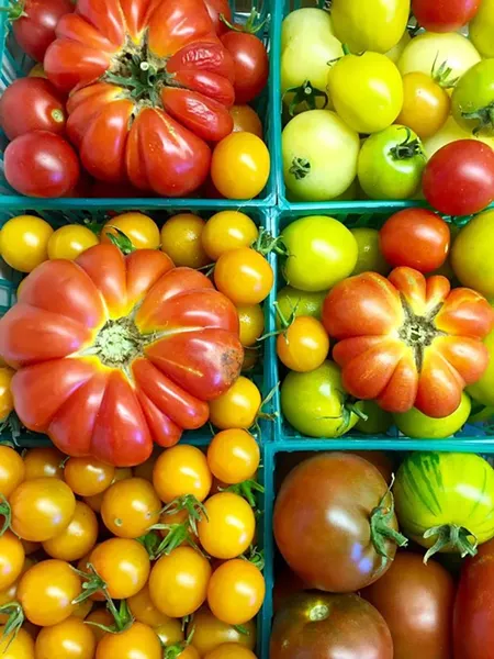 FAMILY HEIRLOOMS Chef Julie Simon of SLO, known for her culinary creativity (most recently at her former position at Foremost Wine Company), will create a breathtaking farm-to-table feast on Sunday, Sept. 24, from 5 to 8 p.m. Savor multiple courses, showcasing Windrose Farm heirloom tomatoes, locally raised meats, and seasonal produce paired with local wines. - PHOTO COURTESY OF WINDROSE FARM